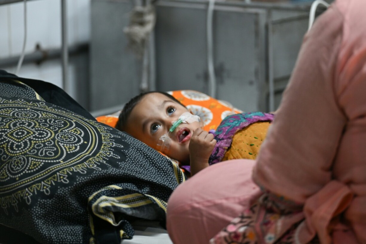 A child receives treatment for measles at the Bangladesh Shishu Hospital & Institute in Dhaka on September 3