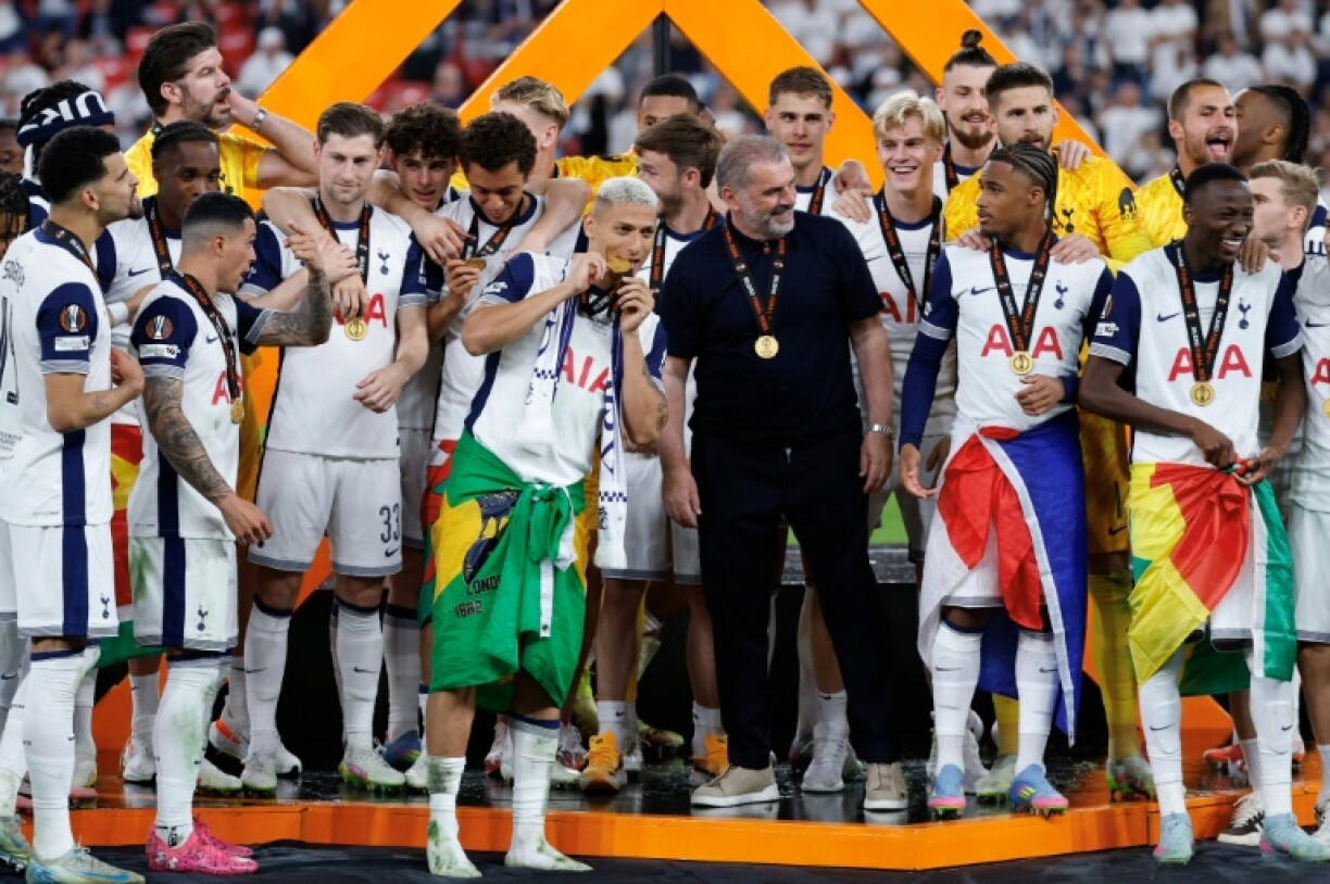 Tottenham Hotspur's manager Ange Postecoglou celebrates with his players after they won the Europa League final