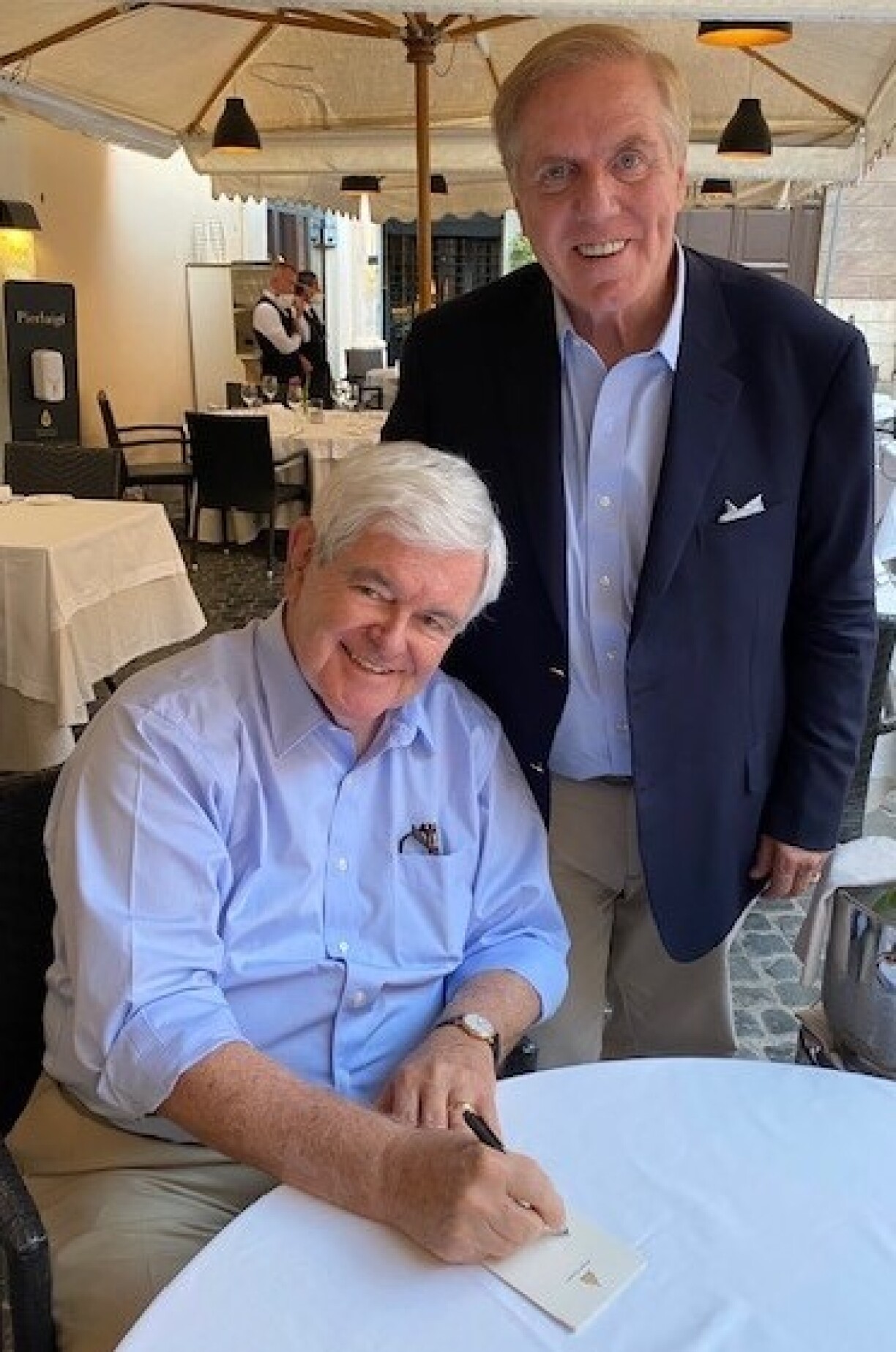 US Ambassador J. Randolph Evans (standing) with Newt Gingrich.