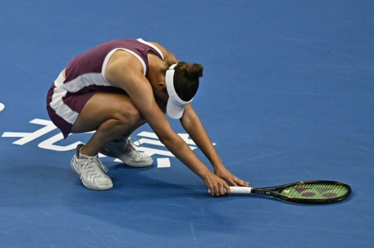Belgium's Elise Mertens reacts after winning her women's singles quarter-final match against Poland's Iga Swiatek at the China Open tennis tournament in Beijing on October 9, 2026.