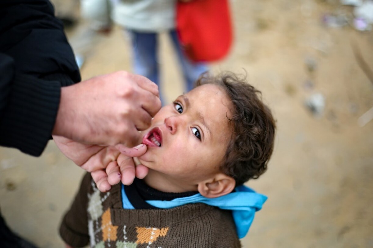 Children received polio vaccine doses at a camp for displaced people in Nuseirat