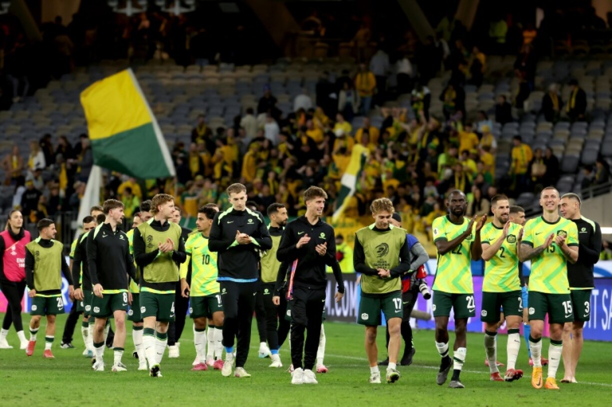 Australia's players celebrate victory over Japan