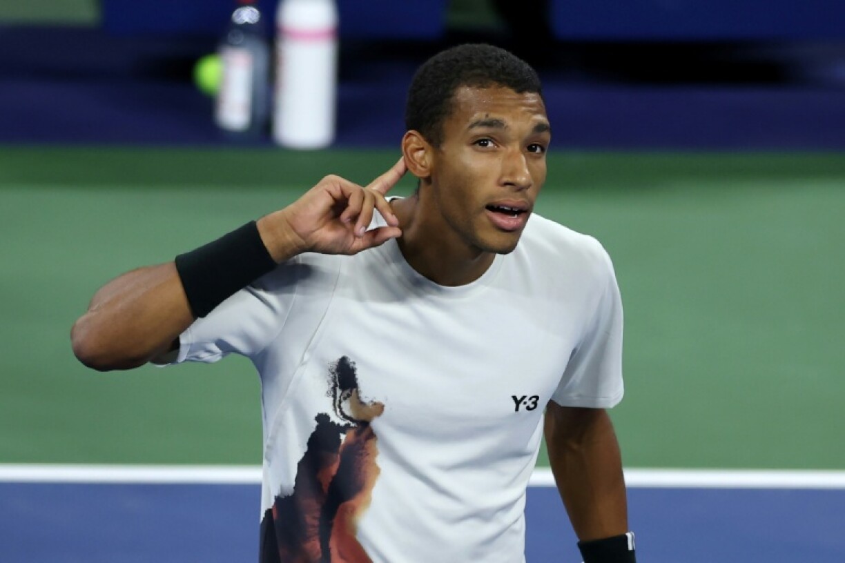 Felix Auger-Aliassime celebrates his victory over Alexander Zverev