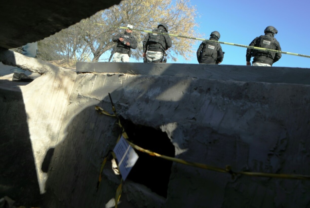 Mexican National Guard agents stand guard at an illegal tunnel connecting to El Paso in Texas