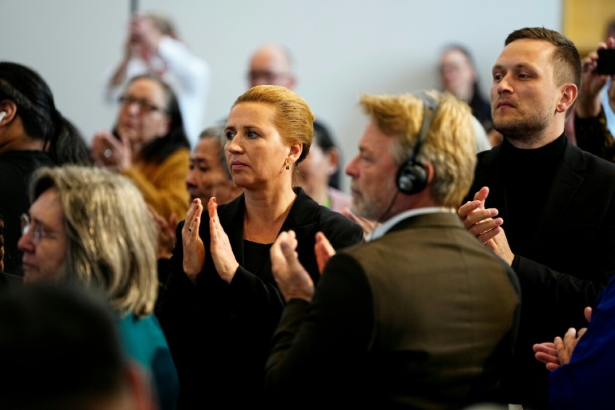 Jens-Frederik Nielsen (R) and Mette Frederiksen listened to the speeches delivered by victims of the policy