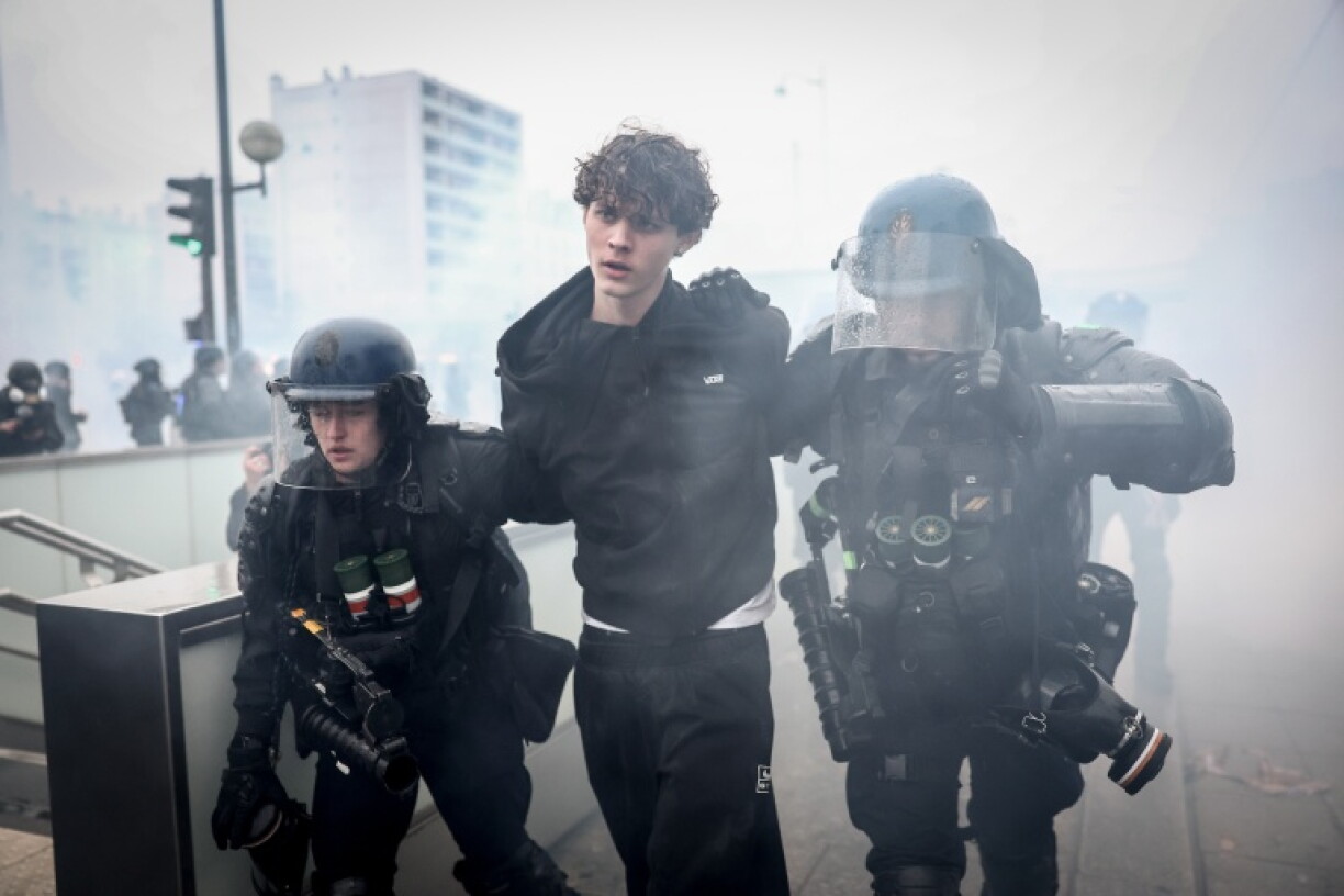French police arrest a protester during a demonstration in Paris on Saturday