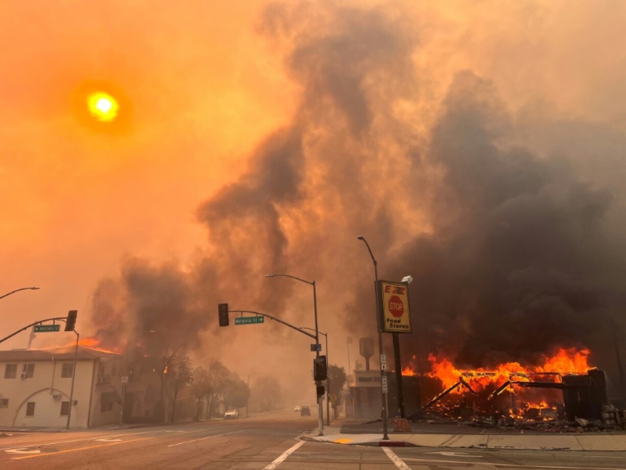 Flames from the wind-driven Eaton Fire engulf a house in Altadena, California, January 8, 2025