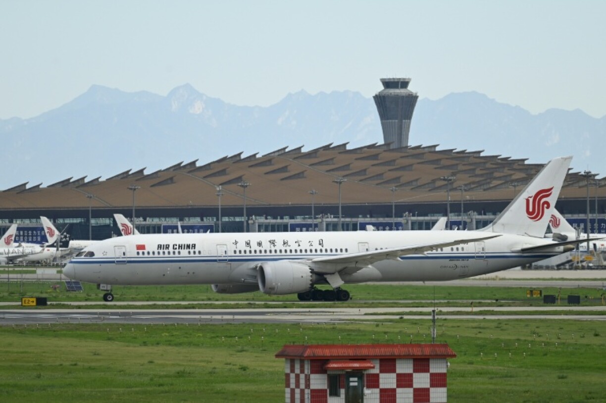 An Air China flight was safely diverted to Shanghai after a battery stowed in a passenger's carry-on luggage caught fire