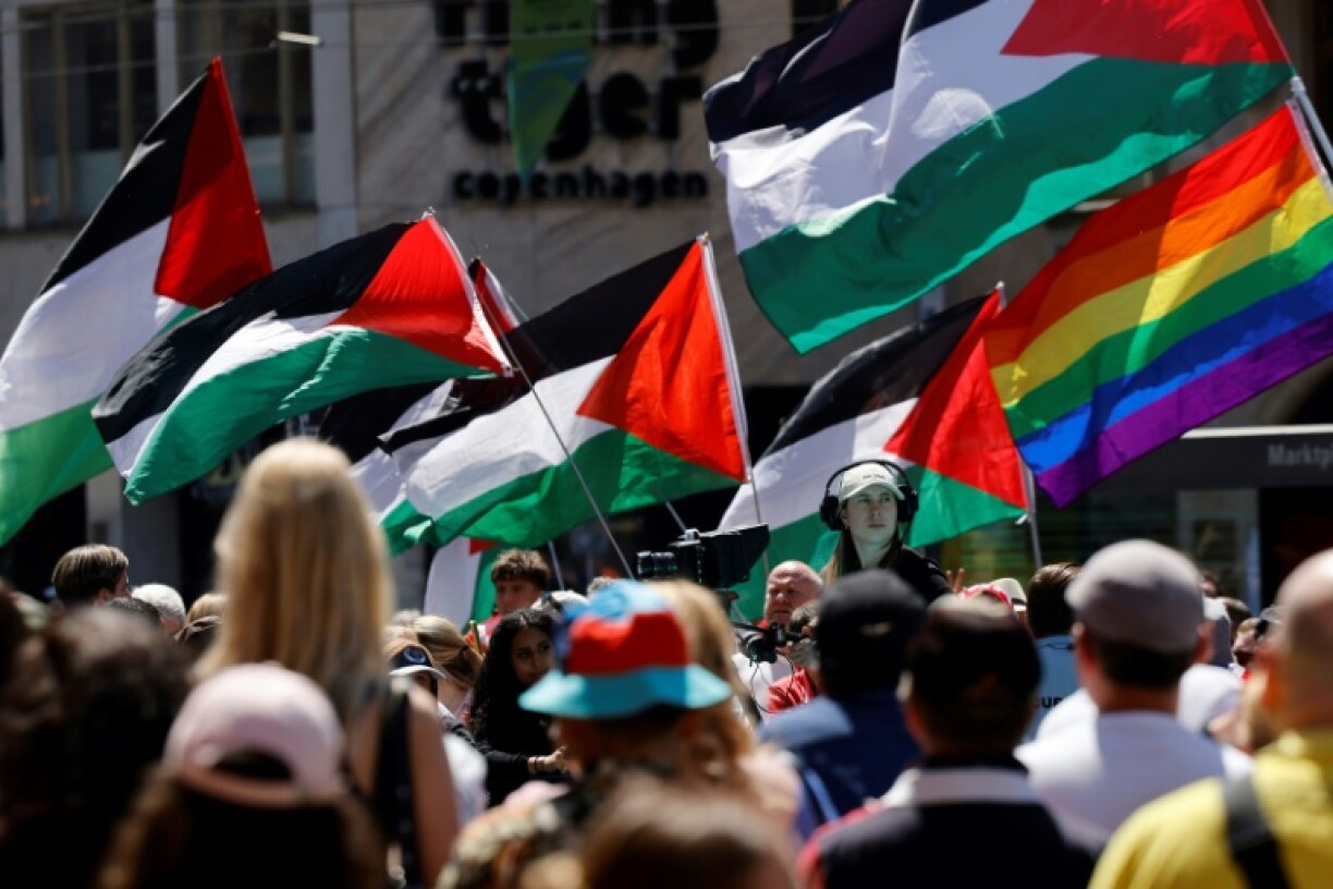 Protesters wave Palestinian flags at the Eurovision Song Contest opening ceremony