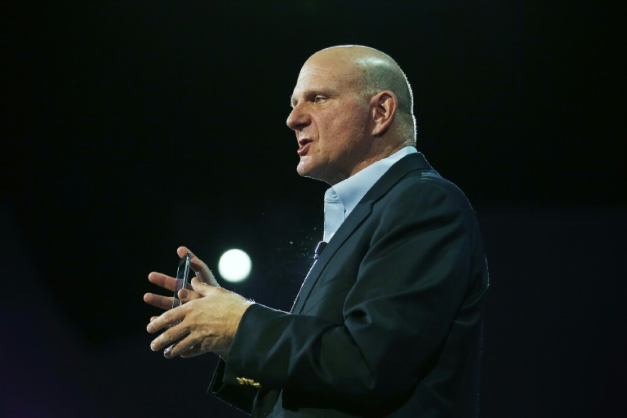 Steve Ballmer, then the Microsoft CEO, holds a smartphone during an event launching an updated model in San Francisco, California in October 2012