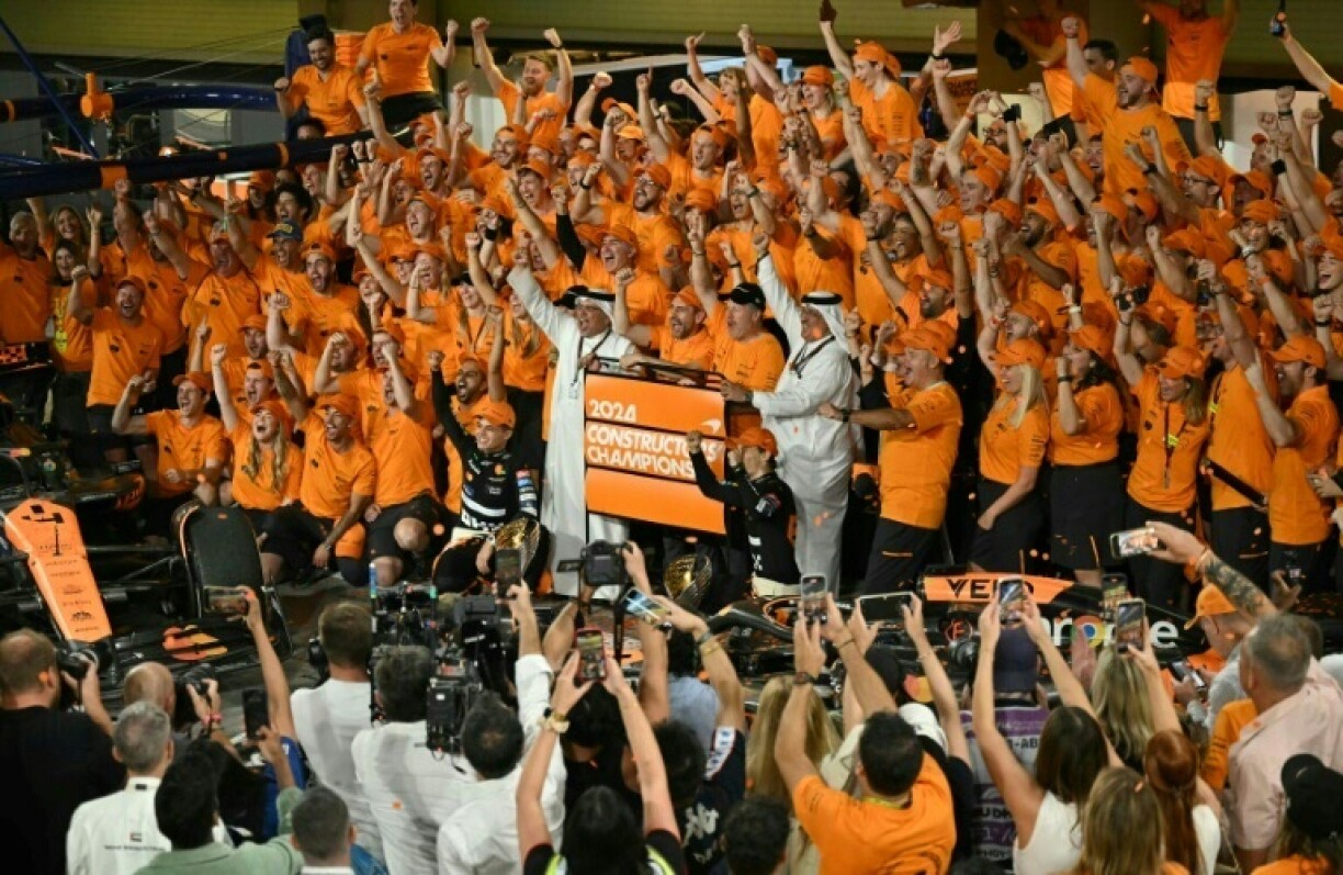 Lando Norris and Oscar Piastri celebrate winning McLaren's first team title in 26 years at the Abu Dhabi Formula One Grand Prix