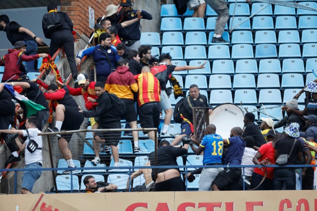 Mamelodi Sundowns and Esperance supporters clash after a CAF Champions League quarter-final in Pretoria.