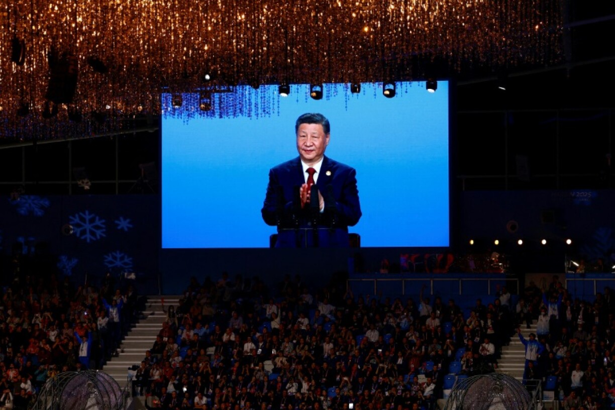 China's President Xi Jinping is pictured on a screen during the opening ceremony of the 2025 Asian Winter Games in Harbin in China's northeast