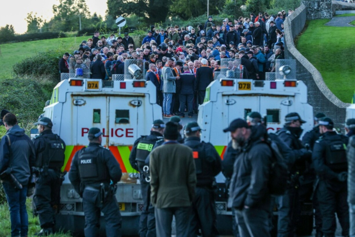 Orangemen and supporters gathered at a church after being stopped by police from marching to Garvaghy Road in Portadown, Northern Ireland