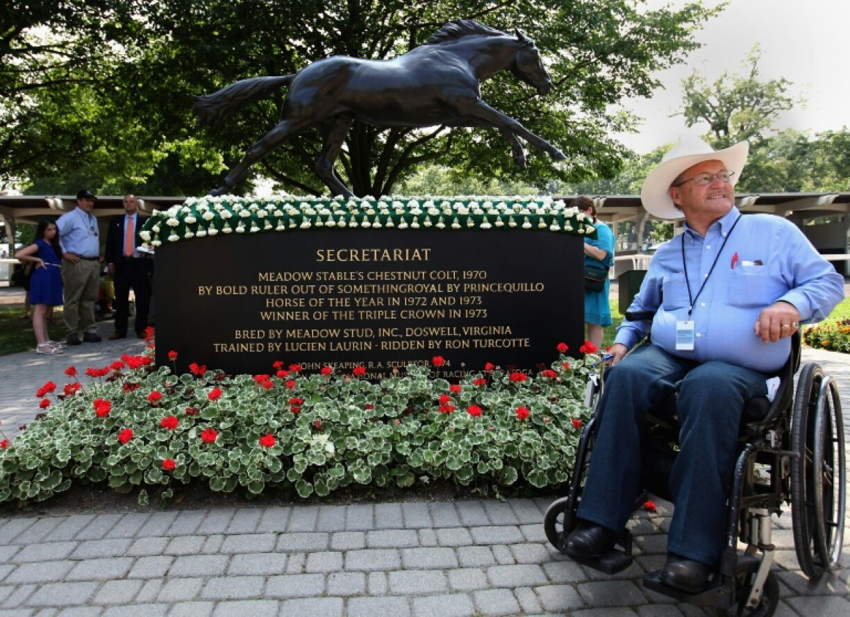 Ron Turcotte, jockey of 1973 Triple Crown winner Secretariat, poses for photos at Belmont Park in 2012