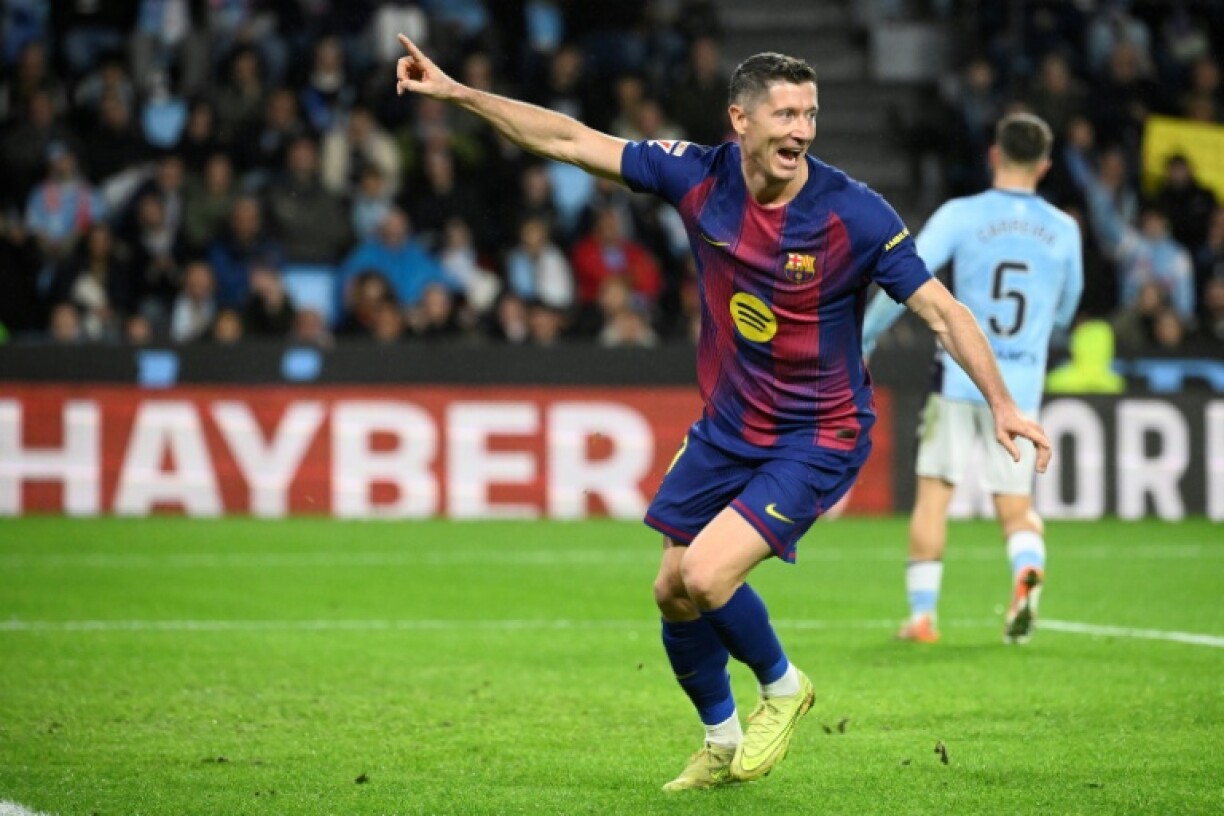 Barcelona's Polish forward Robert Lewandowski hit a treble as his team beat Celta Vigo on Sunday in La Liga