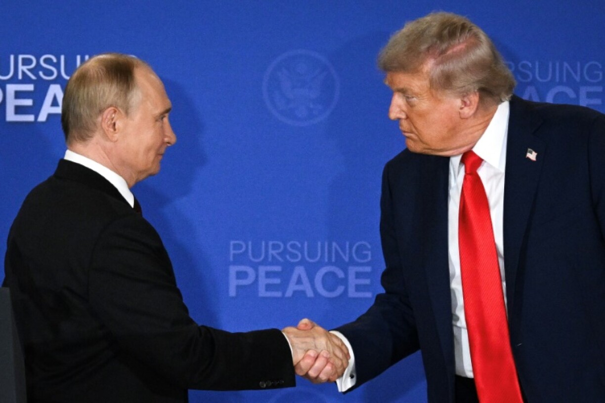 US President Donald Trump and Russian President Vladimir Putin shake hands at the end of a summit at Joint Base Elmendorf-Richardson in Anchorage, Alaska