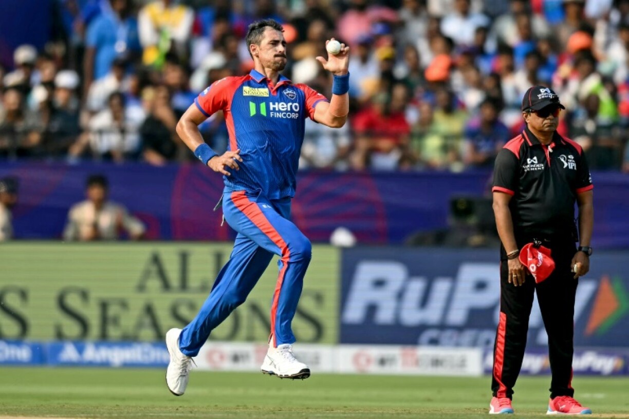Mitchell Starc (L) delivers a ball during the IPL match between Delhi Capitals and Sunrisers Hyderabad