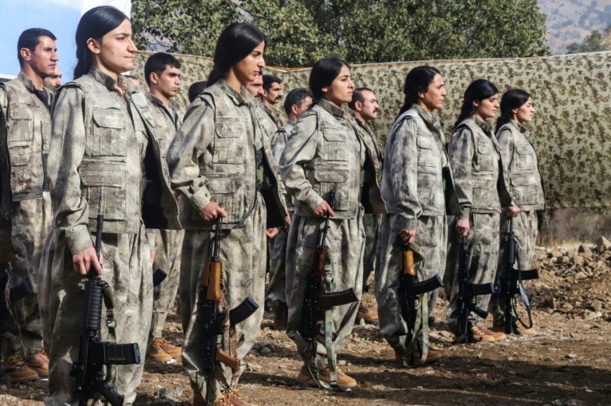 A first group of 25 PKK fighters who had left Turkey for northern Iraq were at the ceremony, among them eight women