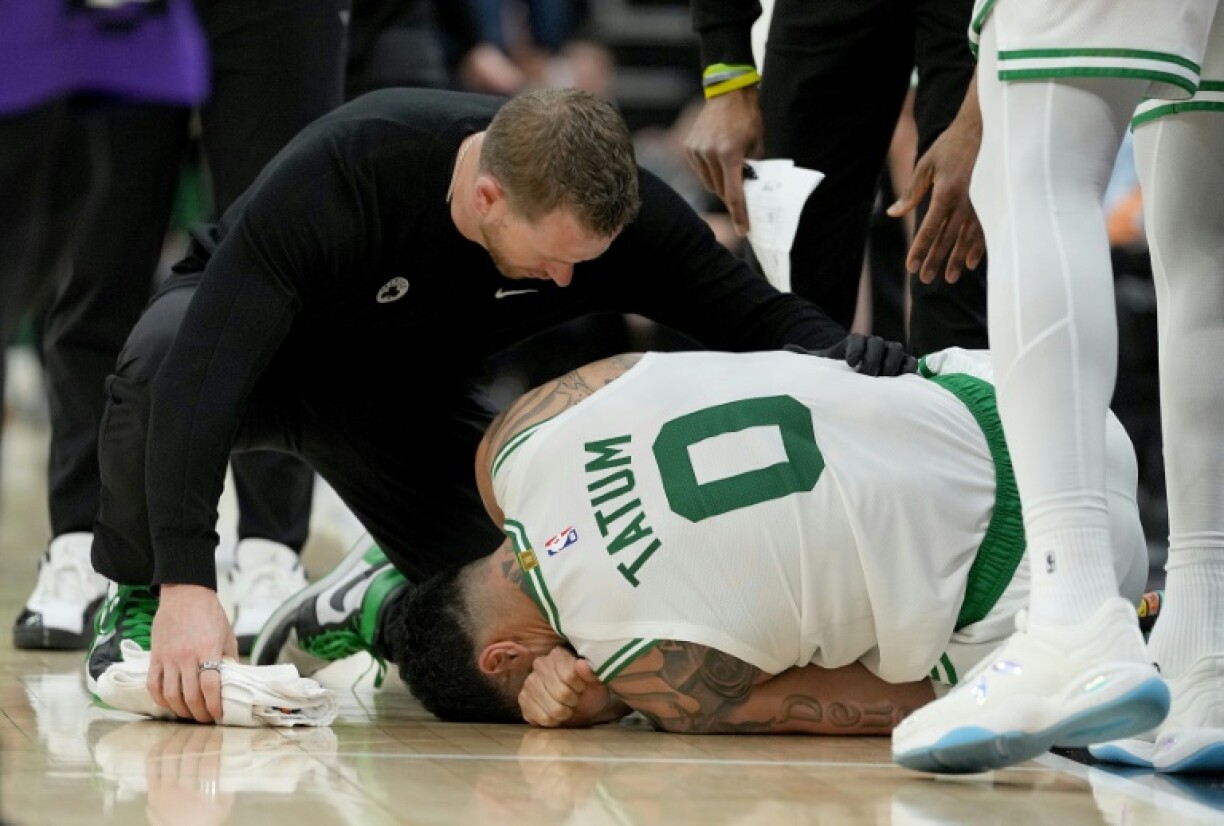 Boston star Jayson Tatum lies on the court in pain after turning his ankle in the Celtics' NBA victory over the Sacramento Kings