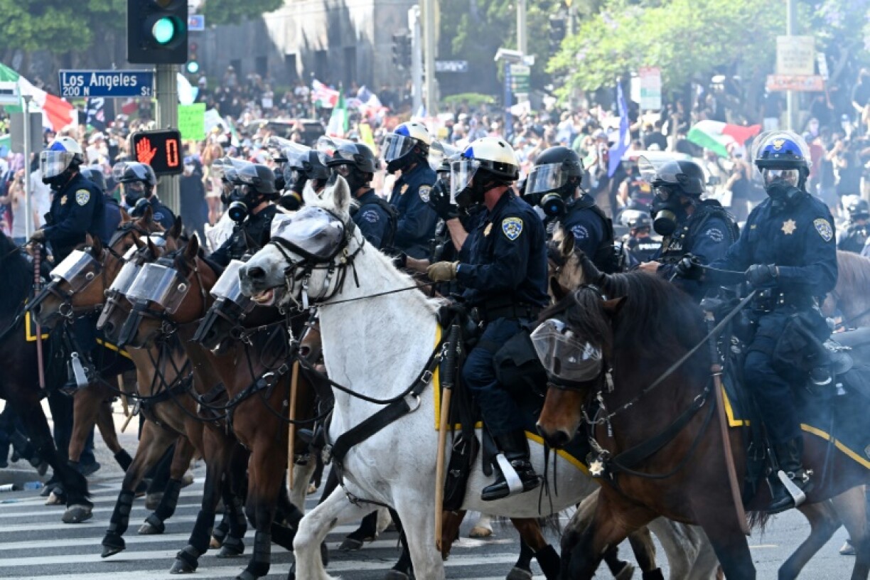Thousands of protesters have taken to the streets in Los Angeles, sometimes clashing with local law enforcement
