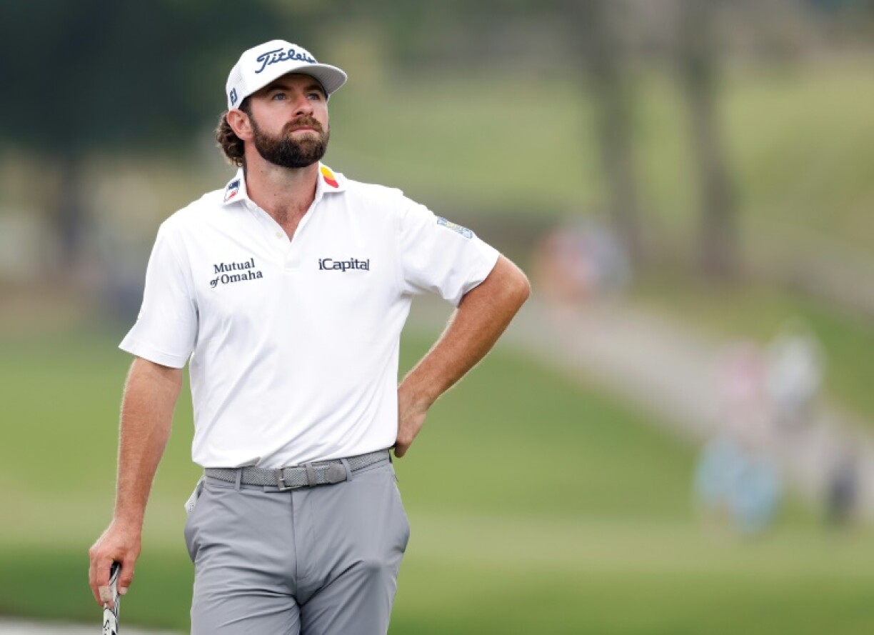 American Cameron Young had a one-stroke lead with three holes remaining when play was halted for the day at the PGA Wyndham Championship following a long lightning delay