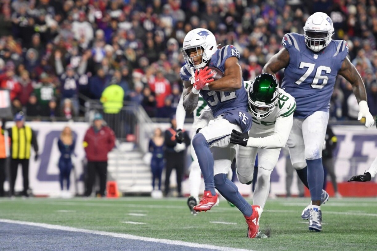 TreVeyon Henderson of the New England Patriots rushes for a touchdown in an NFL victory over the New York Jets