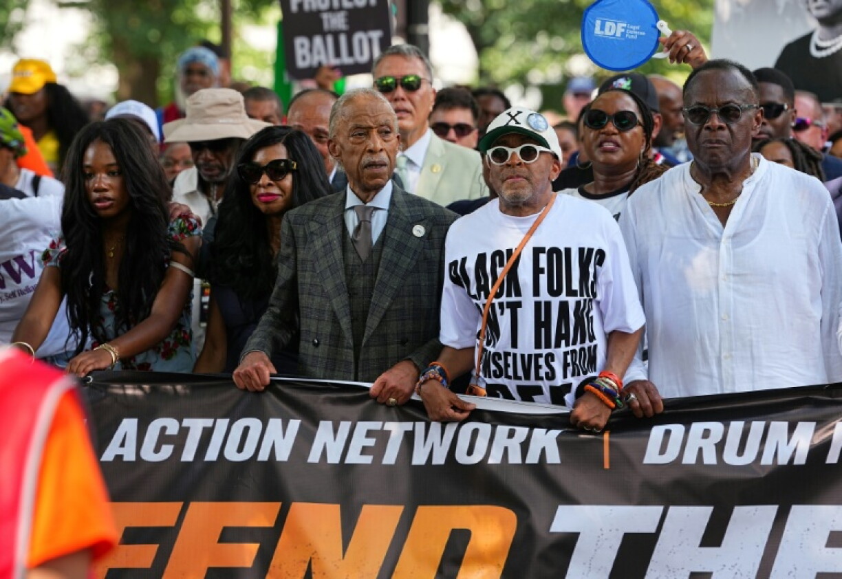 US civil rights activist Al Sharpton, pictured (in suit and tie) on an August 2026 march with movie director Spike Lee, says the Trump administration's immigration raids have generated anxiety among African Americans