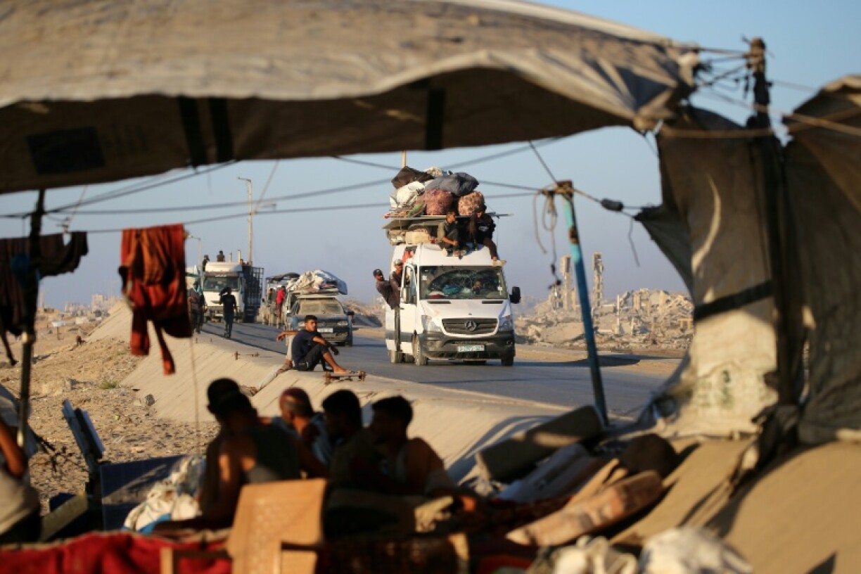 Palestinians flee Gaza City in vehicles piled high with their belongings, passing already crowded tents by the roadside.