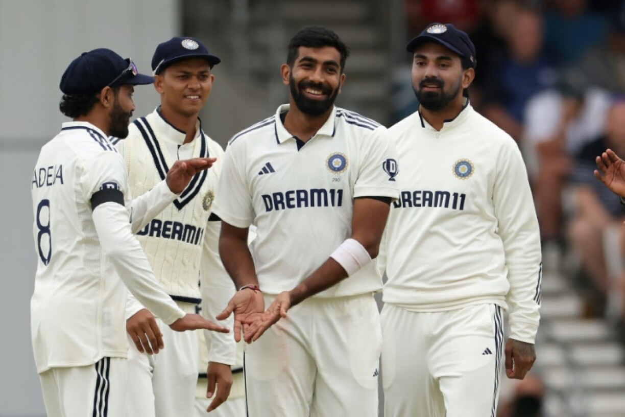 India's Jasprit Bumrah (C) celebrates with team-mates after dismissing England's Chris Woakes in the first Test at Headingley