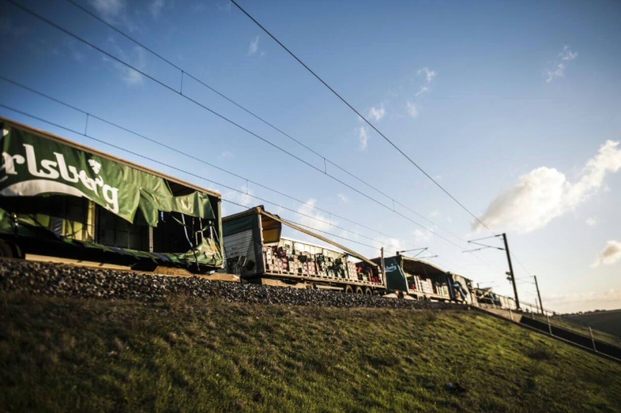 Media reports said the roof of a cargo train blew off in heavy winds and hit a passenger train