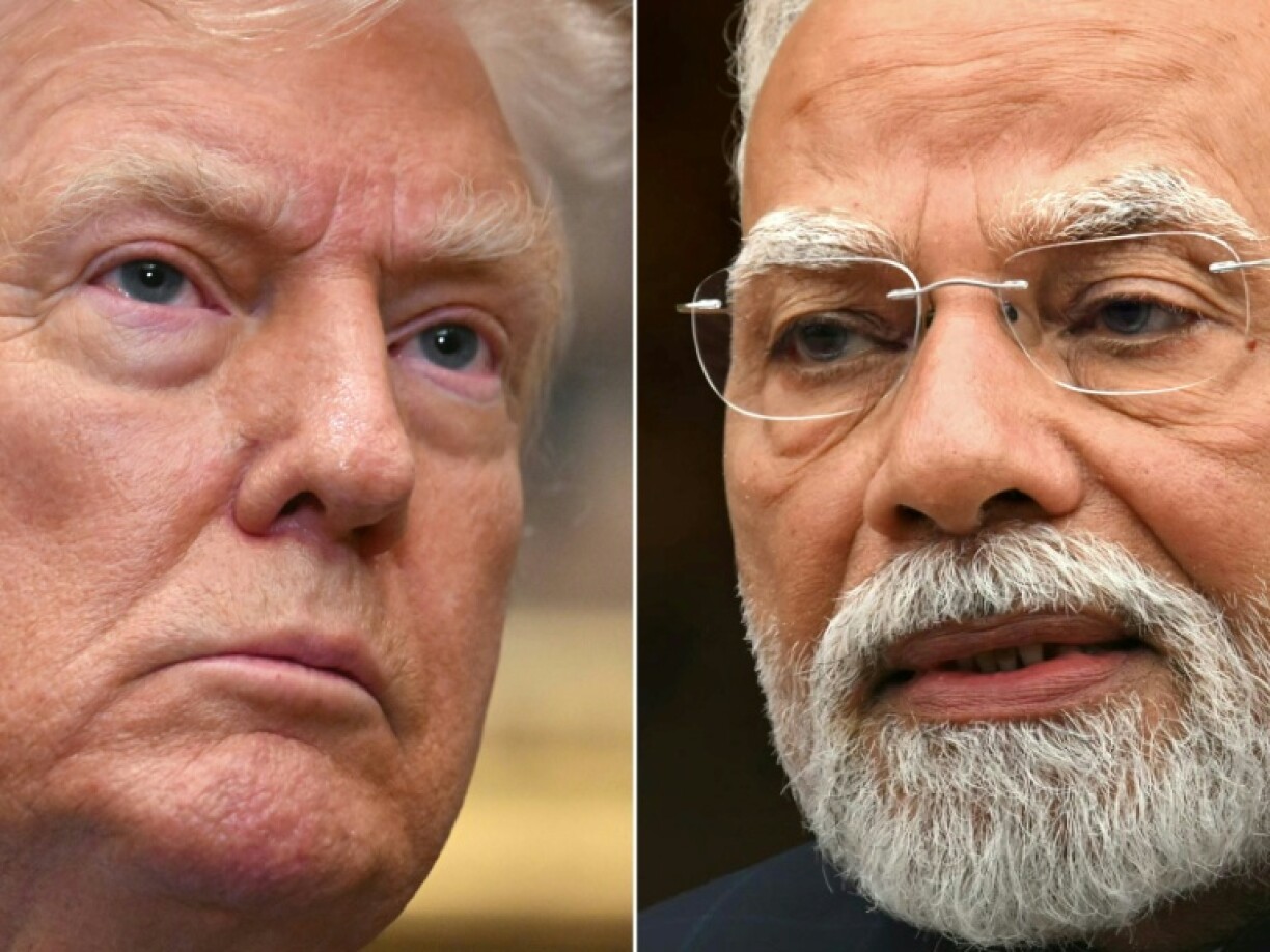 Indian Prime Minister Narendra Modi (R) is slashing consumption taxes as his economy braces for painful US tariffs levied by President Donald Trump