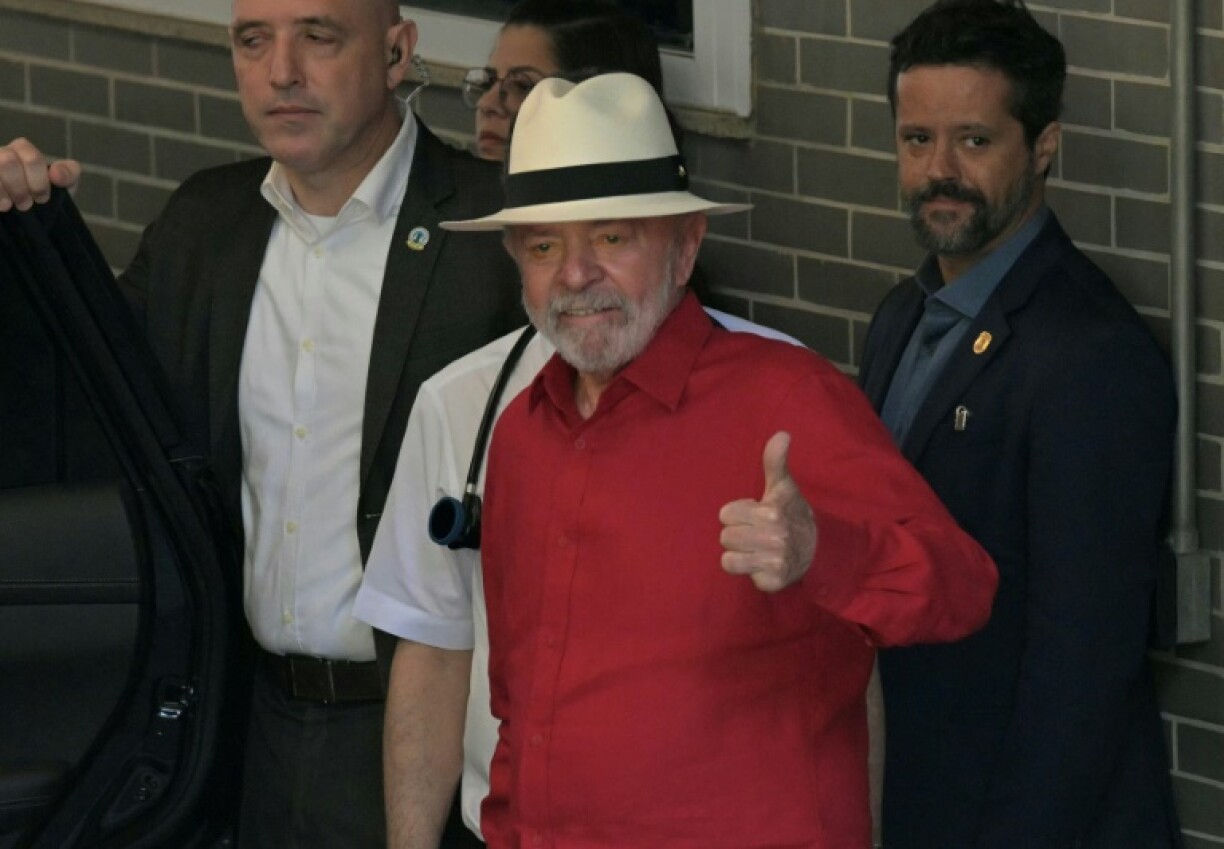 Brazil's President Luiz Inacio Lula da Silva gives a thumbs-up after getting his medical all-clear