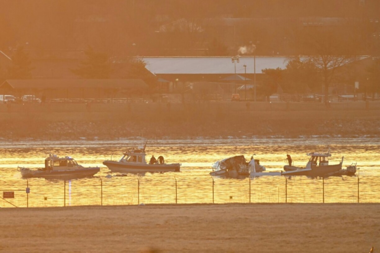 Rescuers on boats search the waters of the Potomac River after a plane carrying several elite figure skaters crashed near Washington's Reagan National Airport