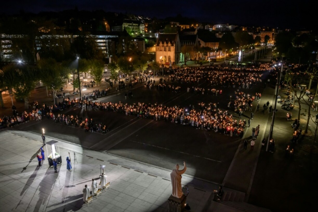 A torch-light parade in honour of Pope Francis at Lourdes in France