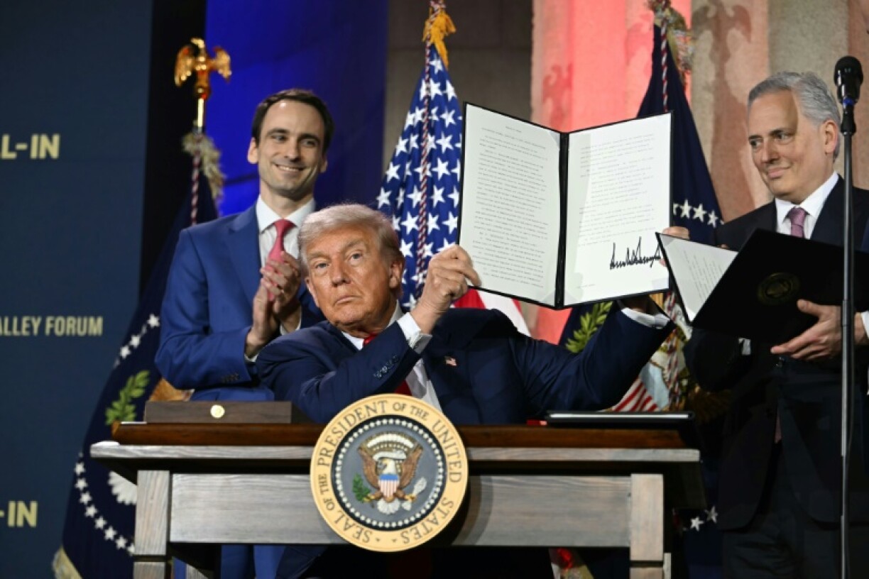 Trump signed several executive orders to give his AI plan more legal weight, with his AI czar David Sacks (R) by his side