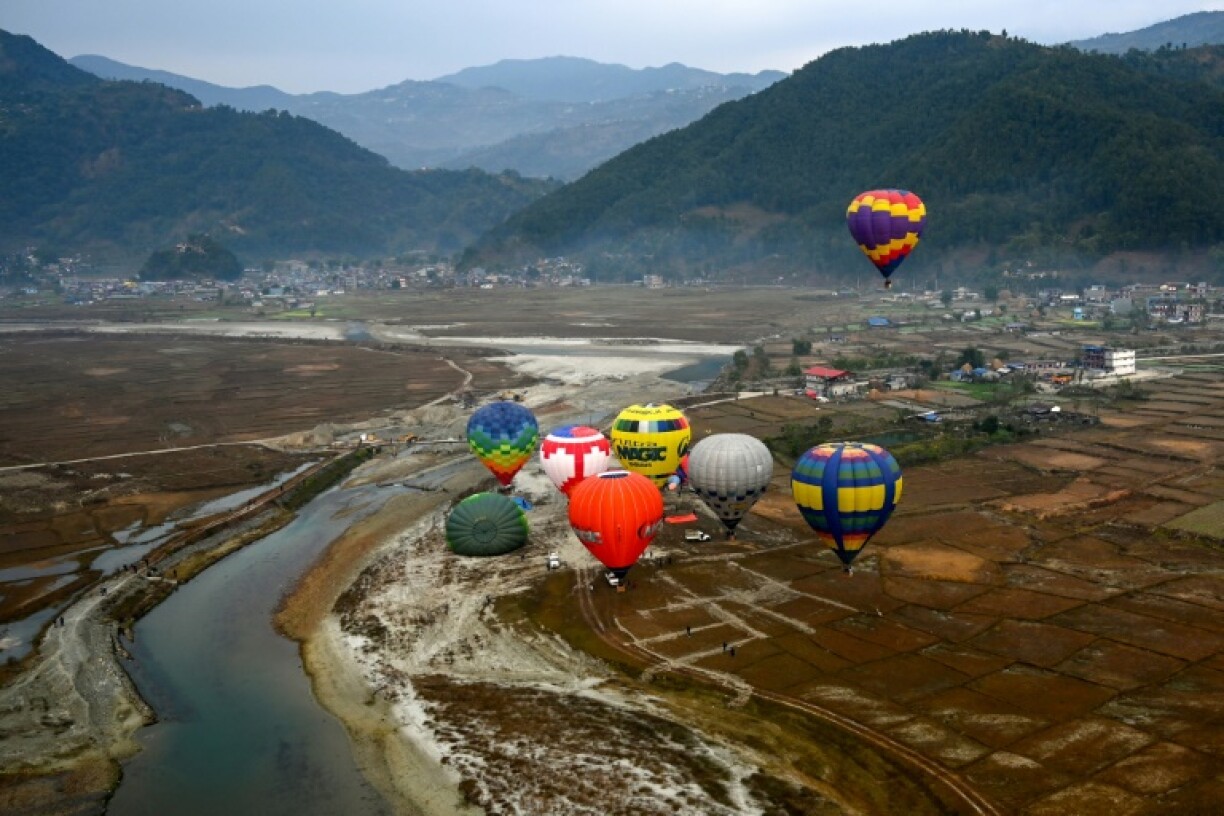 Hot air balloons rise in the sky during the International Hot-Air Balloon festival in Pokhara