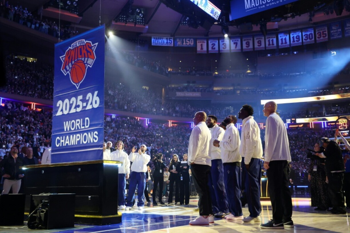 The New York Knicks see their NBA championship banner raised at Madison Square Garden before their season-opening game against the Philadelphia 76ers