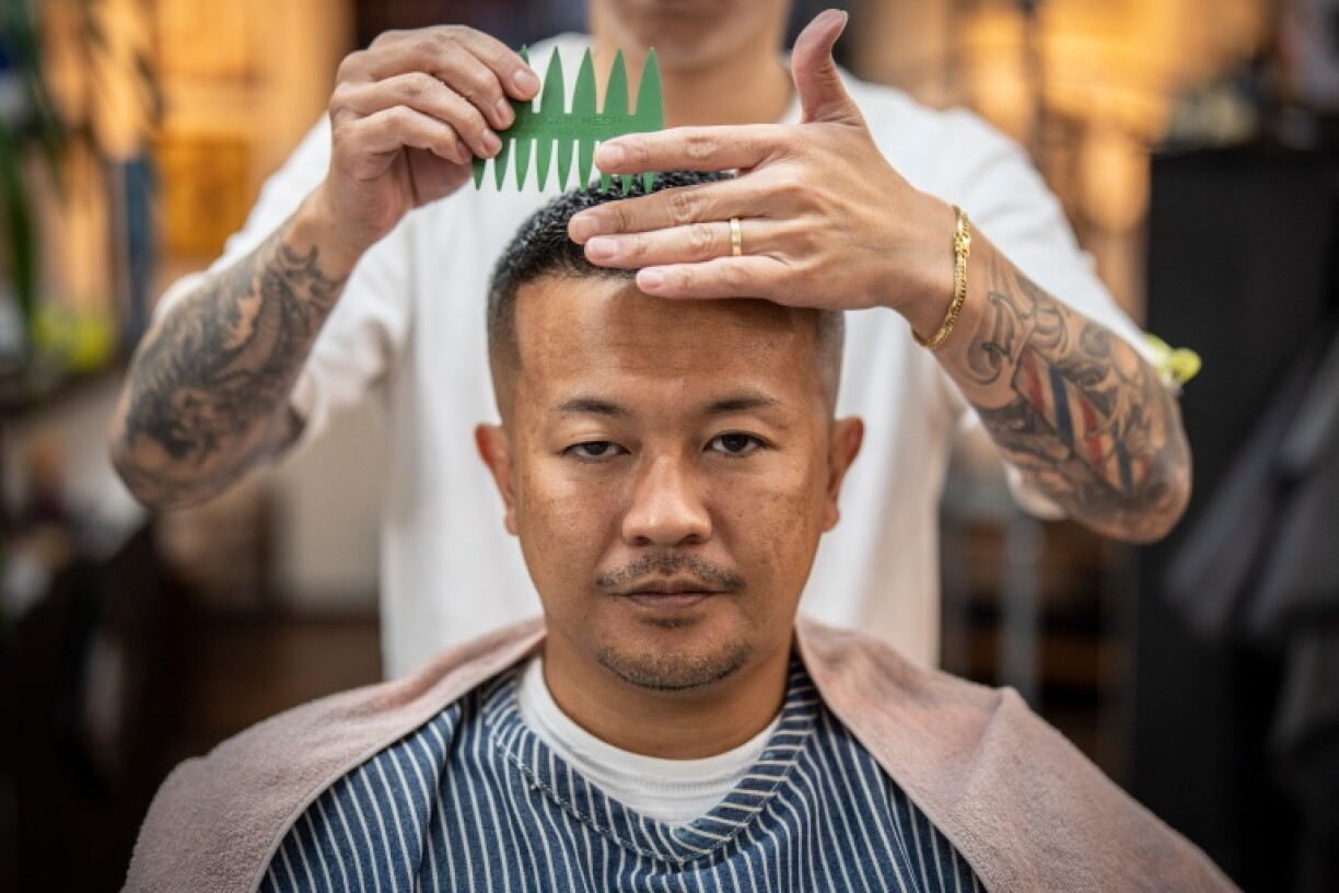 Barbers play a key role in helping Japan's mobsters project an image of mence and wealth