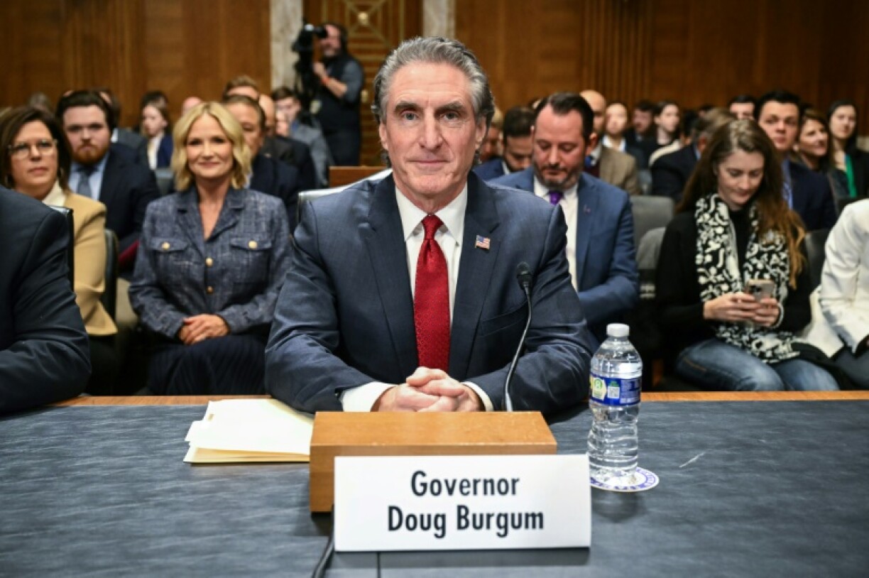Former North Dakota Governor Doug Burgum takes his seat as he arrives for a Senate Energy and Natural Resources Committee hearing