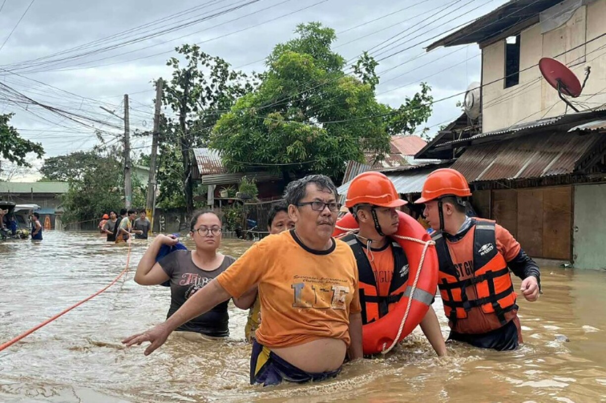 Local disaster official Ethel Minoza told AFP the bodies of two children had been recovered in Cebu City, where rescuers were still attempting to reach residents trapped by floodwaters