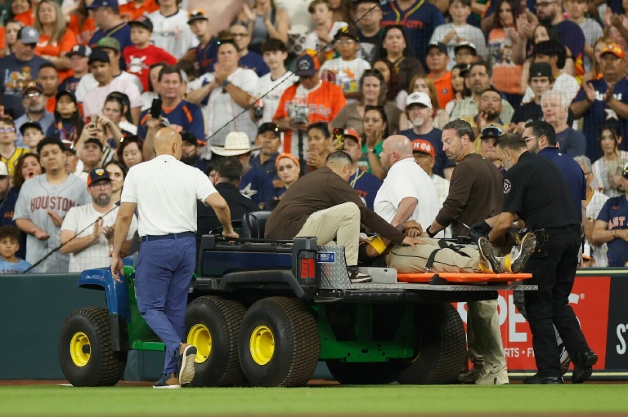 Luis Arraez of the San Diego Padres is carted off the field after colliding with Mauricio Dubon in the first inning of a Major League Baseball game against the Houston Astros