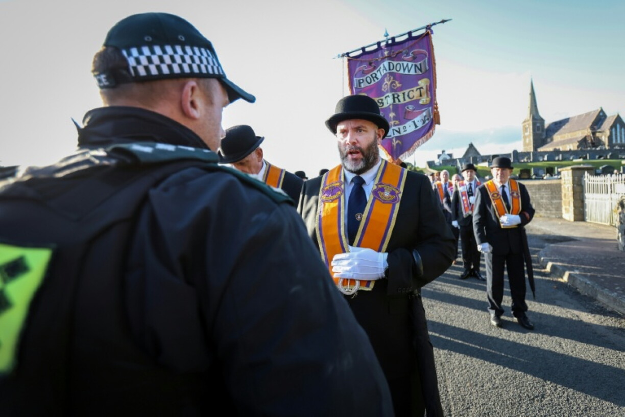 A group of Orangemen had been due to march through the Catholic neighbourhood, but locals blocked their way
