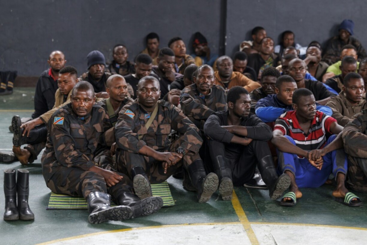 Congolese soldiers surrendered their arms and crossed into Rwanda as refugees