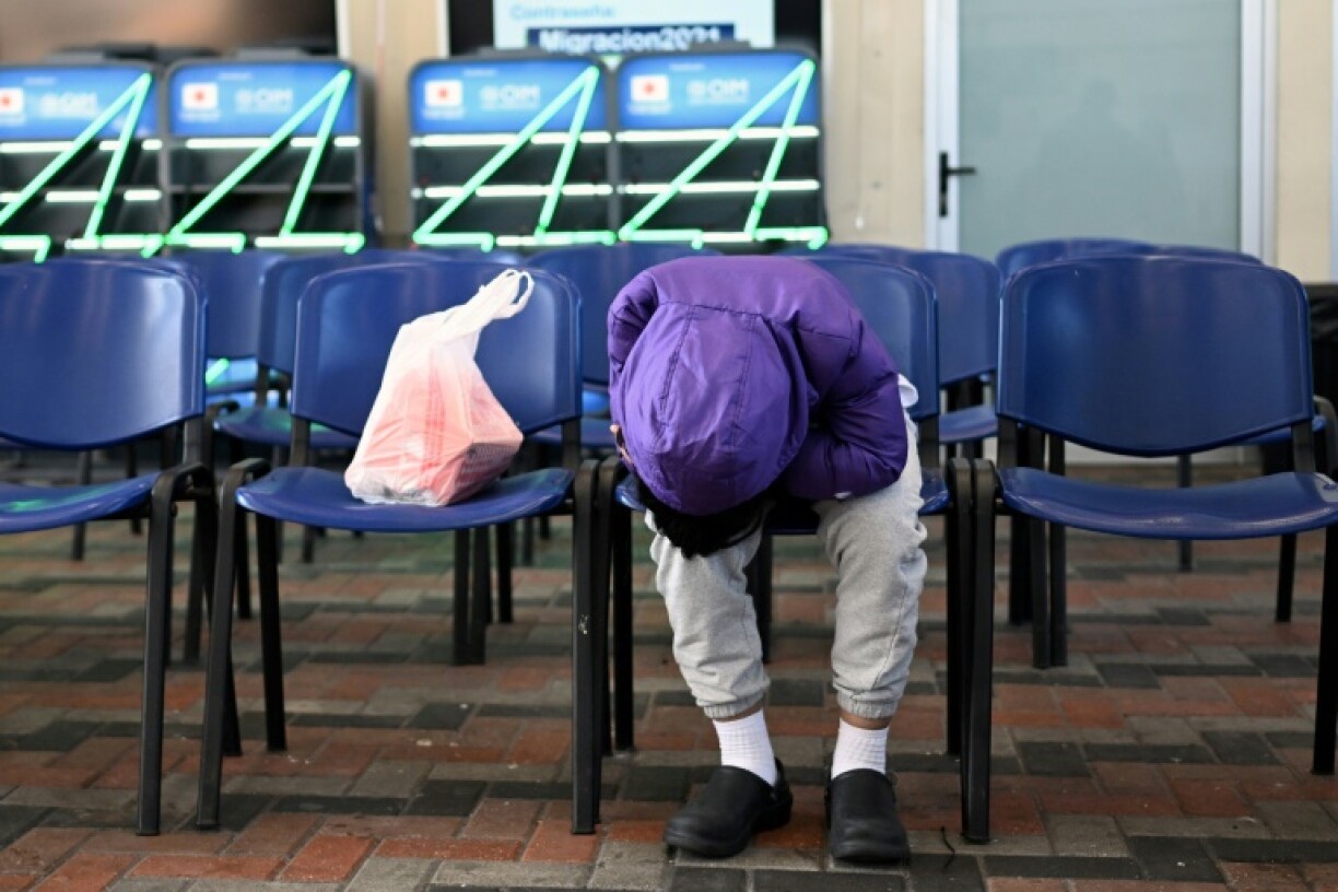 A Guatemalan migrant deported from the United States waits at the Returnee Reception Center upon arrival at the Guatemalan Air Force Base in Guatemala City