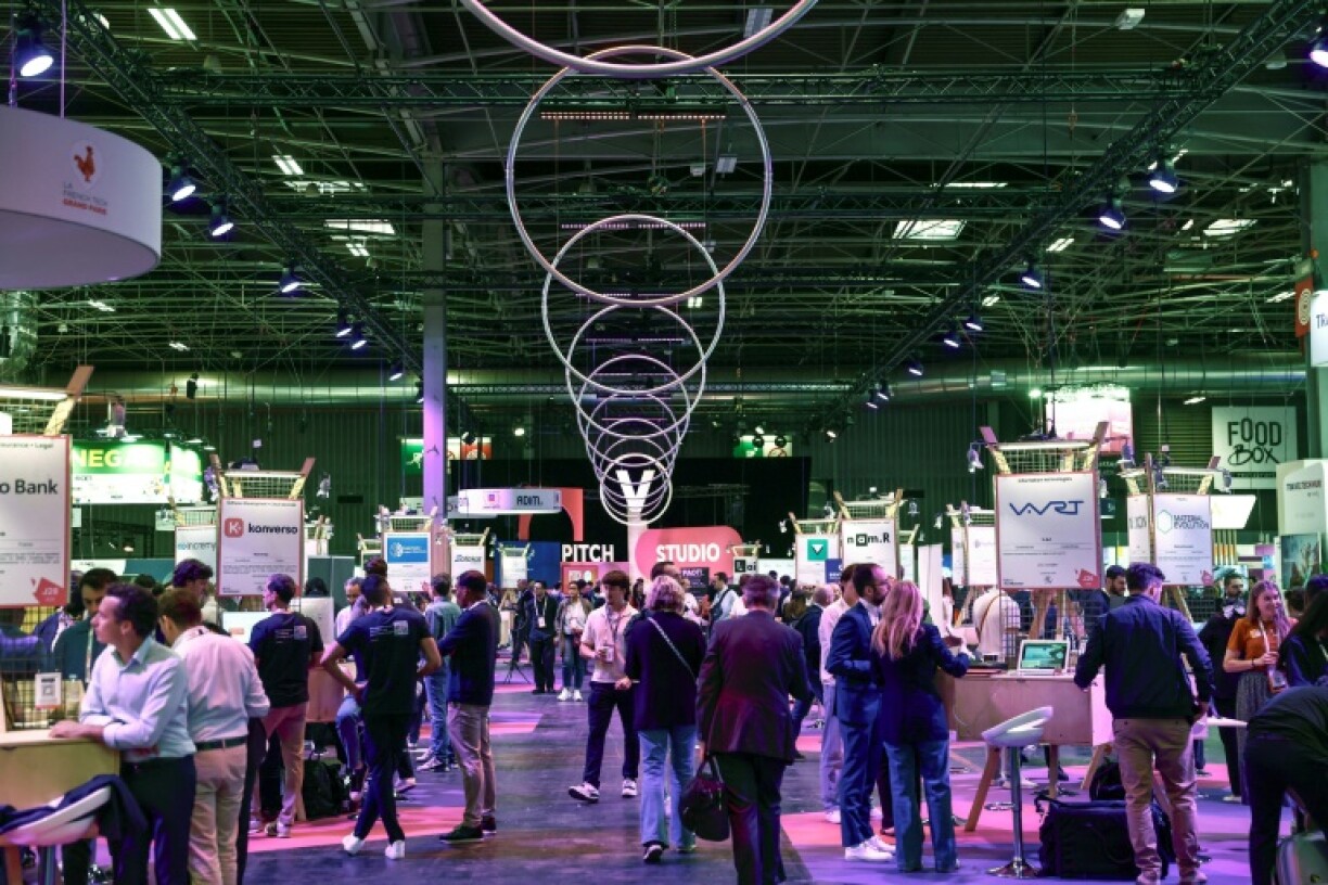Visitors browse through the stands at the VivaTech technology fair at the Paris Expo Porte de Versailles