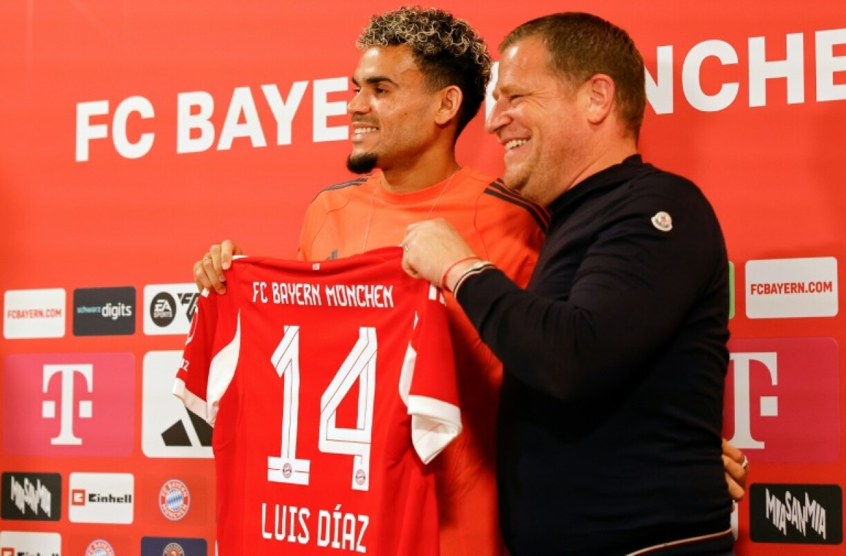 New Bayern Munich forward Luis Diaz (L) smiles alongside sporting director Max Eberl at his unveiling on Thursday.
