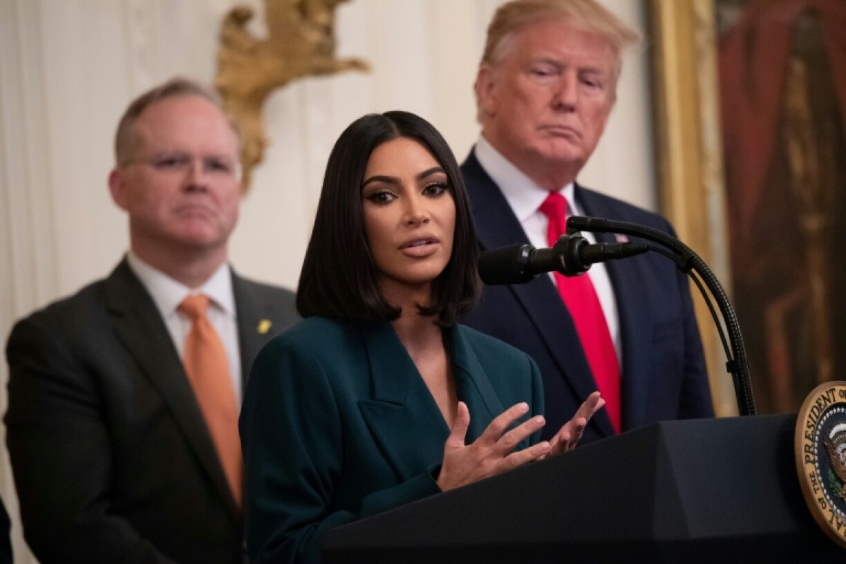 Kim Kardashian spoke out about the Trump administration's immigration raids, seen here speaking alongside US President Donald Trump during a criminal justice reform event in 2019