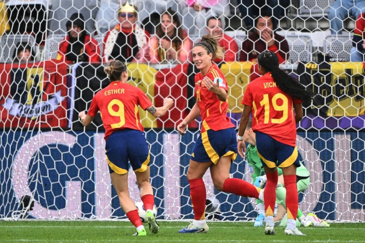 Alexia Putellas (C) celebrating with Esther Gonzalez (9) and Vicky Lopez (19) after scoring the opening goal for Spain against Belgium