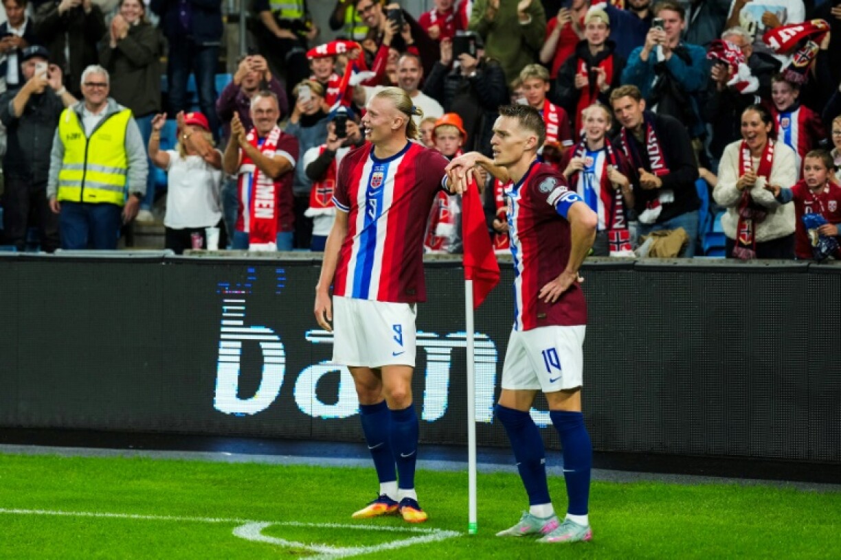 Erling Haaland (L) scored five goals against Moldova